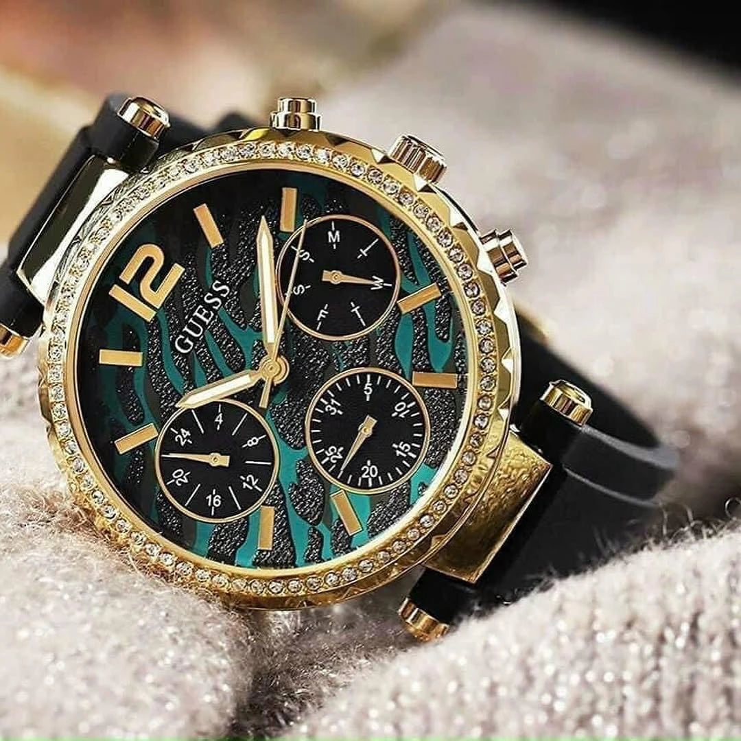 Guess GW0113L1 Solstice montre femme dorée avec cadran vert et bracelet silicone noir